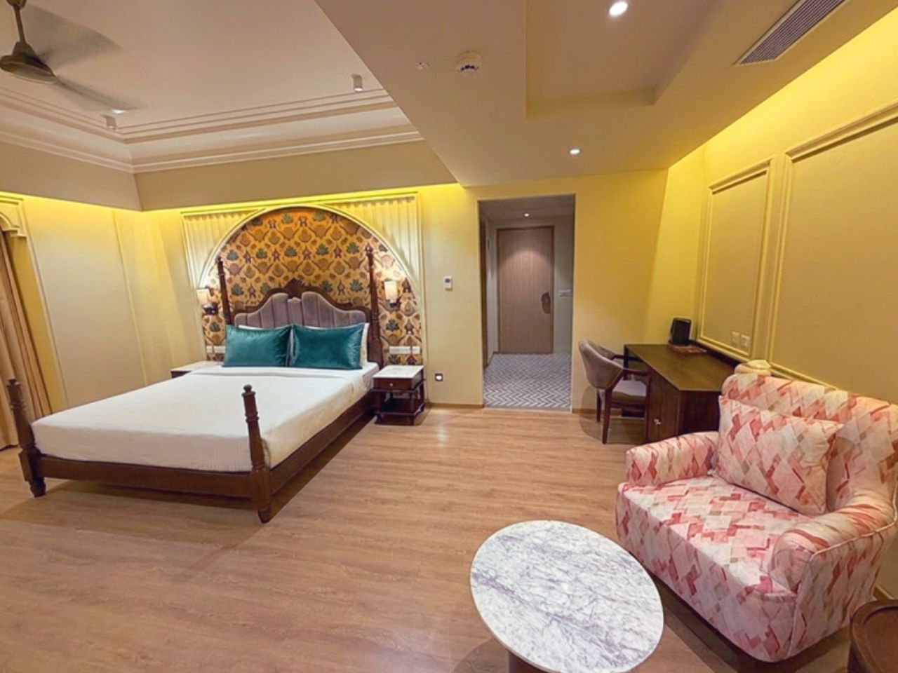 Comfortable luxury bed in an air-conditioned room at Vankamal Resort, Jaipur