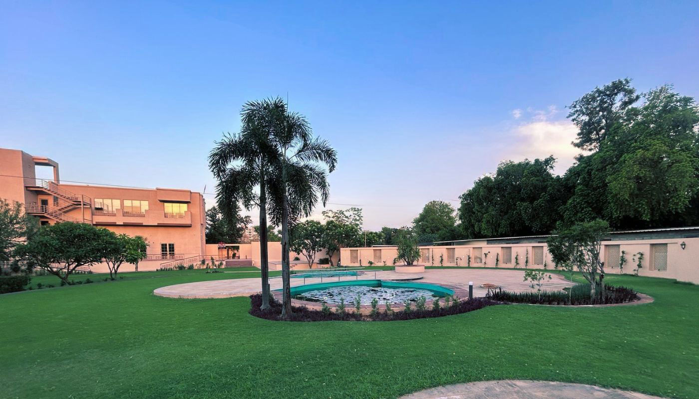 Vankamal resort garden with lotus pond at dusk, Kalwar Road Jaipur